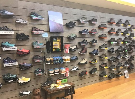 wall of trailrunners and hiking boots