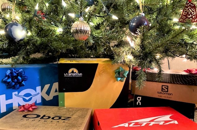 Hiking shoe boxes under a Christmas tree