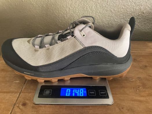 a Danner N45 hiking shoe on a kitchen scale that reads 15 ounces