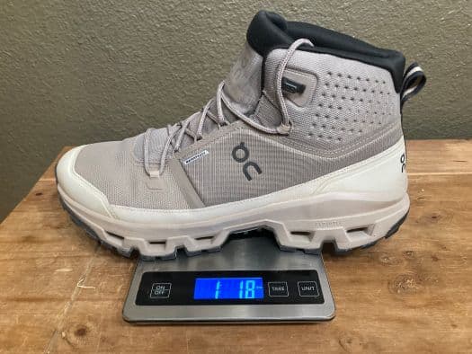 On Cloudrock hiking boot on a kitchen scale that reads 1 lb 1.8 ounces